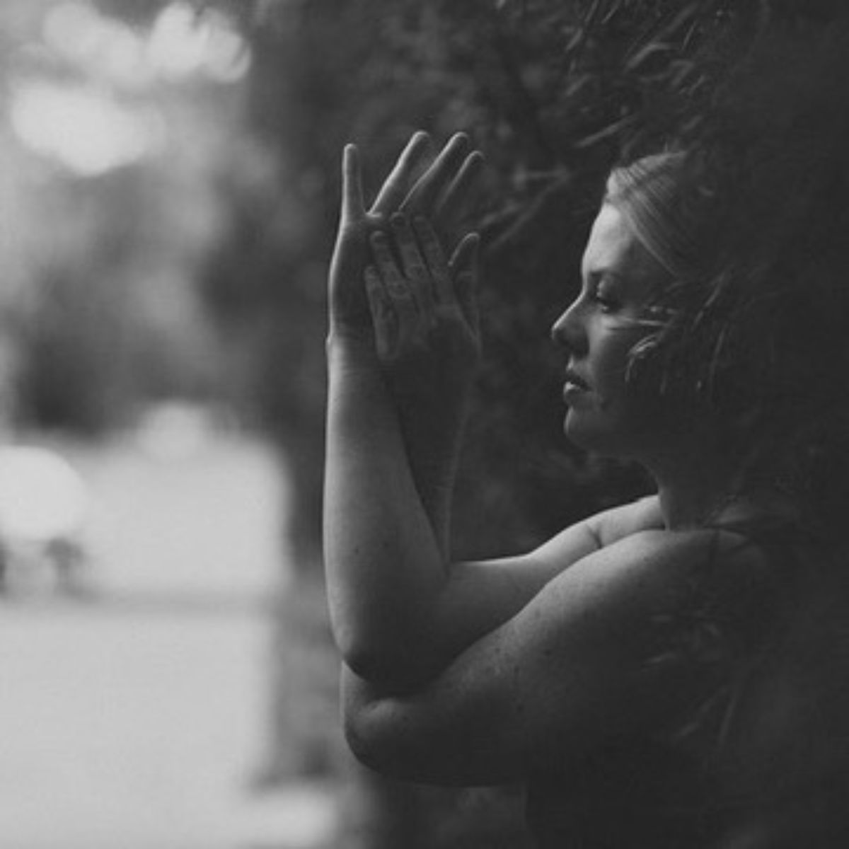 Fionna Findley in profile, hands raised softly